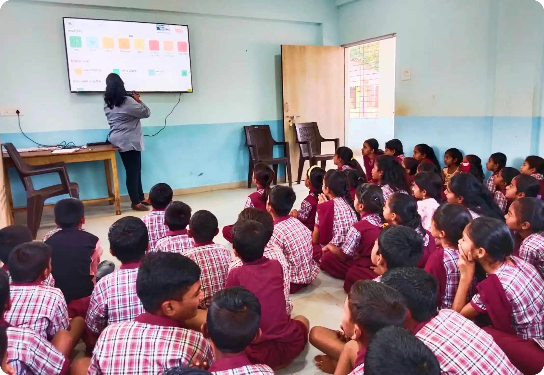 Students engaged in a digital classroom content in Hindi medium implemented by iDream Education