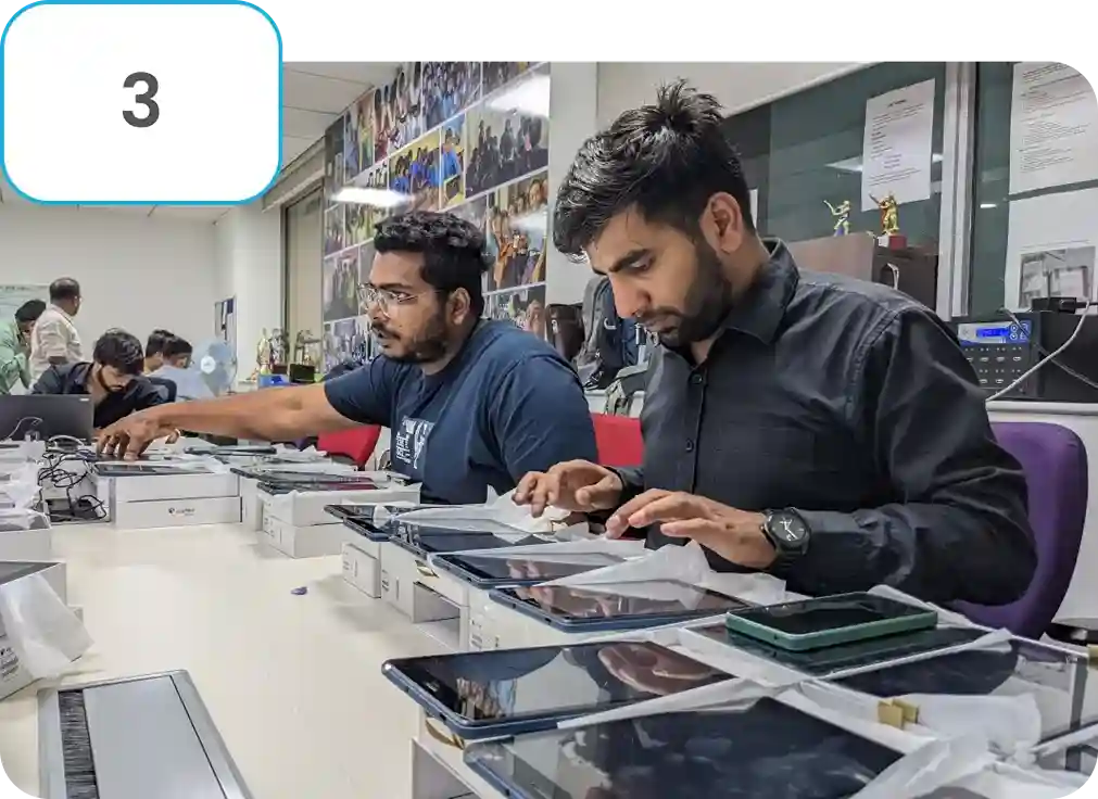 Image of iDream Education team doing device readiness to enable offline digital learning content in a social sector education project
